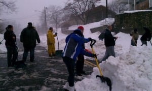 Neighbors at Vanguard Street get together and shovel their street from the top of the hill all the way to Main Street