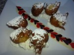 Beignet Chocolate Kisses--battered chocolate morsels, powdered sugar & whipped cream