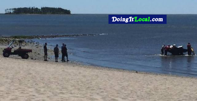 Firefighters launch a jet ski for water rescue.