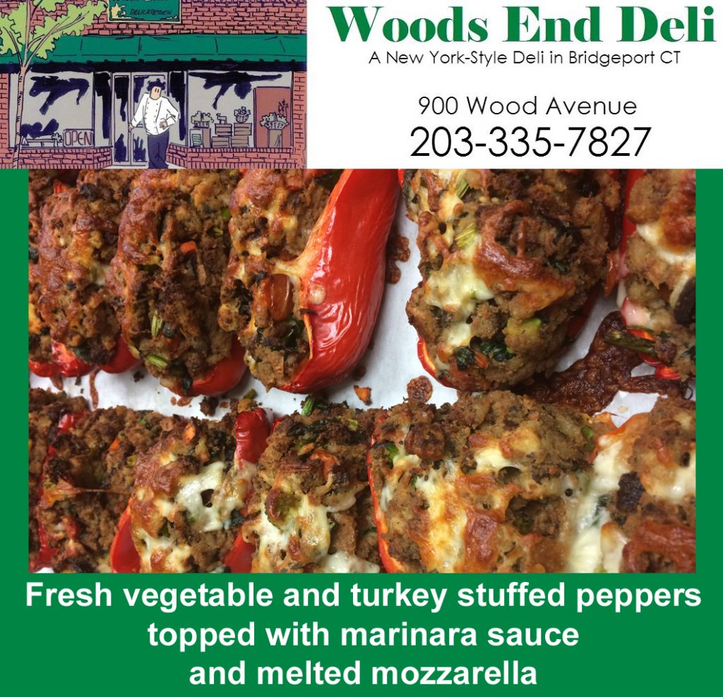 Fresh vegetable and turkey stuffed peppers top with marinara sauce and melted mozzarella